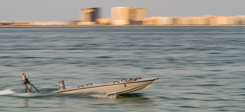 Marines with the All Domain Reconnaissance Detachment of the 11th MEU operate a MANTAS T12 unmanned surface vessel during training with Task Force 59 at Naval Support Activity Bahrain on Oct. 28, 2022.