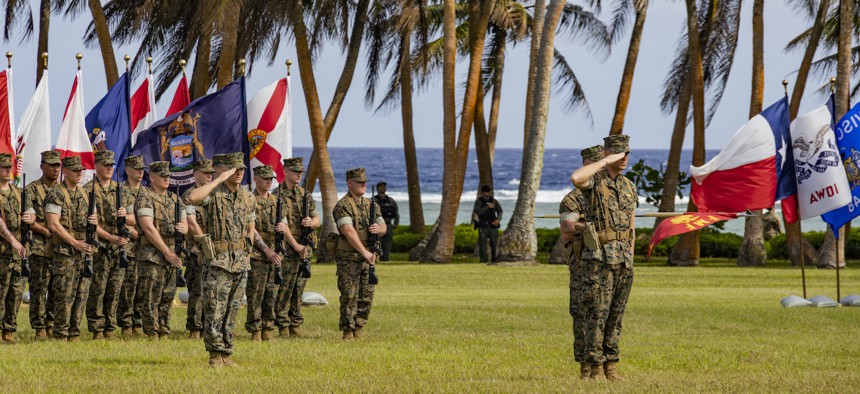 U.S. Marines salute during the Marine Corps Base Camp Blaz Reactivation and Naming Ceremony at Asan Beach, National Historical Park, Asan, Guam, on Jan. 26, 2023. 