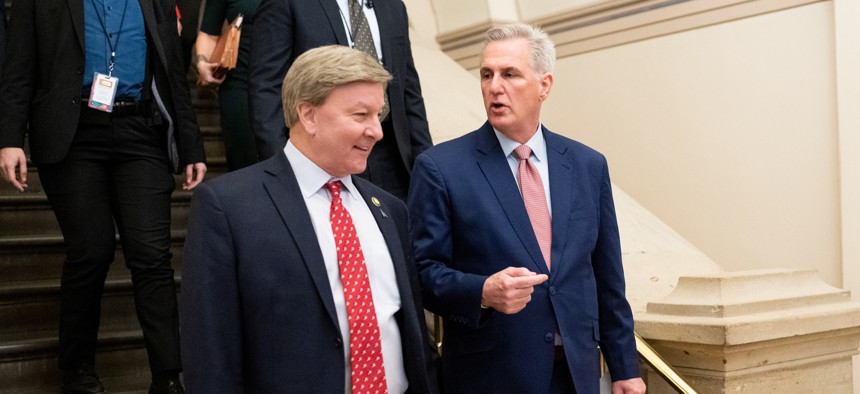 House Republican Leader Kevin McCarthy, R-Calif., right, speaks with Rep. Mike Rogers, R-Ala., as they arrive for the House Republicans caucus meeting in the basement of the Capitol on January 3, 2023.