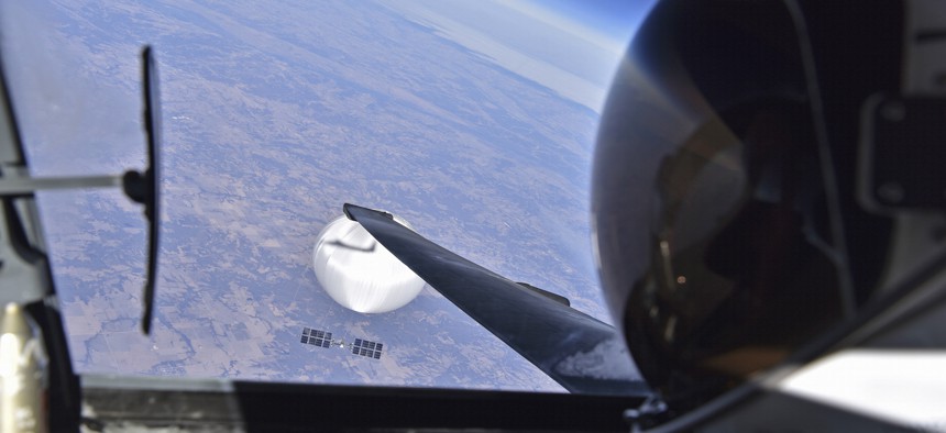 In this handout image provided by the Department of Defense, a U.S. Air Force U-2 pilot looks down at the suspected Chinese surveillance balloon on February 3, 2023 as it hovers over the Central continental United States.