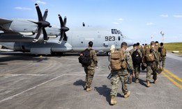 U.S. Marines with III Marine Expeditionary Force Support Battalion, III Marine Expeditionary Force Information Group, board a C-130J Super Hercules on Kadena Air Force Base, Okinawa, Japan, Jan. 20, 2023.
