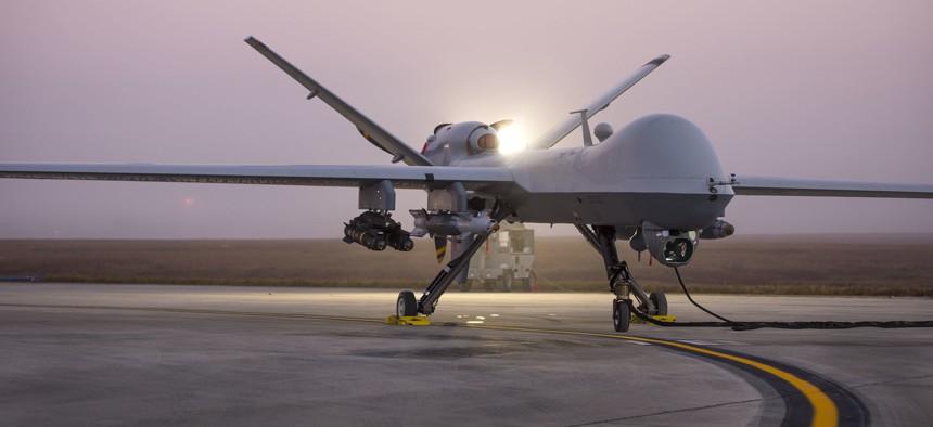 An MQ-9 Reaper sits on the flight line as remotely piloted aircraft crews wait for the fog to clear during Combat Hammer Nov. 6 at Duke Field, Fla. 
