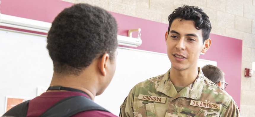 U.S. Air Force recruiter 2nd Lt. Rey Cordova speaks with a student from Renaissance High School in Detroit, Michigan, about the Aim High Flight Academy and Air Force commissioning programs on Nov. 16, 2022.