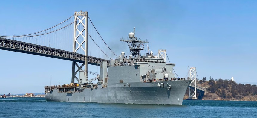 USS Rushmore (LSD 47) crosses under the San Francisco-Oakland Bay Bridge, Oct. 4, arriving for San Francisco Fleet Week 2021.