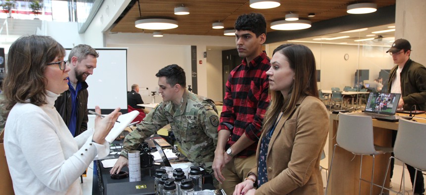 Army civilians with the 781st Military Intelligence Battalion (Cyber), 780th MI Brigade (Cyber), educate Northeastern University students and the public about cyber and Army opportunities at Cyber Day 2019.