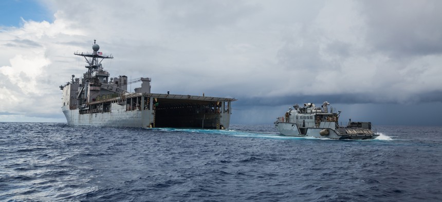 A Mk VI Patrol Boat disembarks from the amphibious dock landing ship USS Comstock (LSD 45) during routine maritime operations in the Philippine Sea in October 2020.