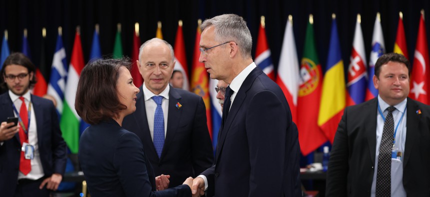 German Foreign Minister Annalena Baerbock, left, and NATO Secretary General Jens Stoltenberg attend the last day of the NATO Summit in Madrid, Spain, on June 30, 2022.