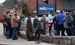 Customers line up outside Silicon Valley Bank in Wellesley, Massachusetts, on March 13, 2023, three days after the bank collapsed.