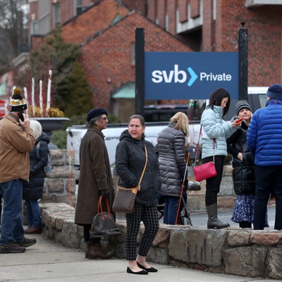                      Customers line up outside Silicon Valley Bank in Wellesley, Massachusetts, on March 13, 2023, three days after the bank collapsed