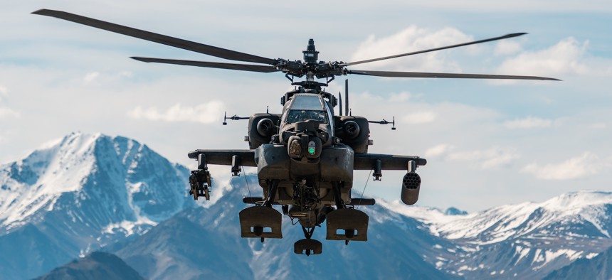 U.S. Army AH-64D Apache Longbow attack helicopter assigned to 1st Battalion, 25th Aviation Regiment Attack Reconnaissance Battalion (ARB) in flight over an Alaskan mountain range near Fort Wainwright, Alaska, June 3, 2019.
