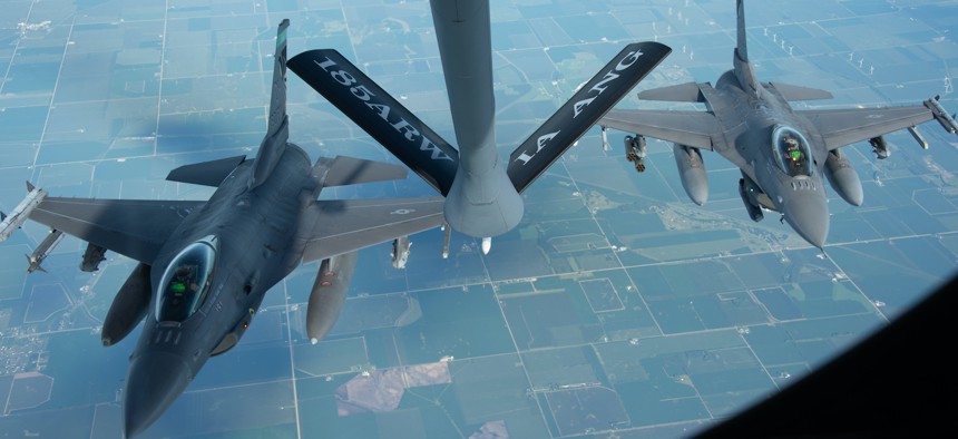Two U.S. Air Force F-16 Fighting Falcons of the Ohio Air National Guard’s 180th Fighter Wing fly behind a U.S. Air Force KC-135 Stratotanker of the Iowa Air National Guard’s 185th Air Refueling Wing over Iowa, Aug. 11, 2022. 