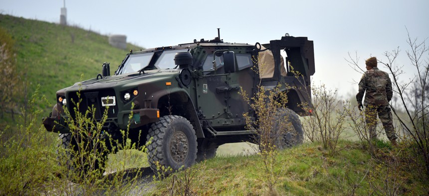 A U.S. Soldier assigned to 10th Special Forces Group (Airborne) observes as one of his counterparts operates a Joint Light Tactical Vehicle during an operational driver's training course in Germany, April 22, 2021.