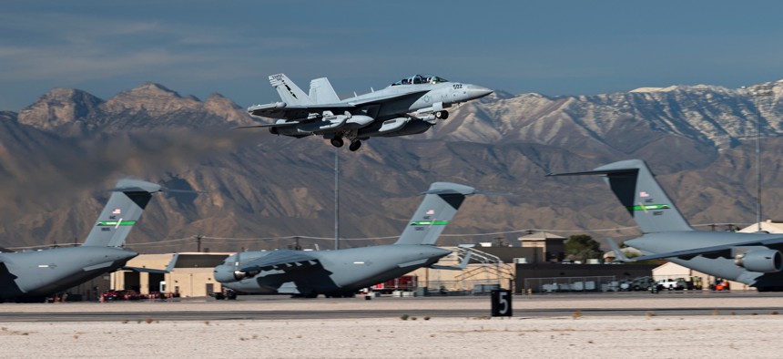 A U.S. Navy EA-18G aircraft assigned to the Naval Aviation Warfighting Development Center at Naval Air Station Fallon, Nevada, takes off on Nov. 21, 2022.