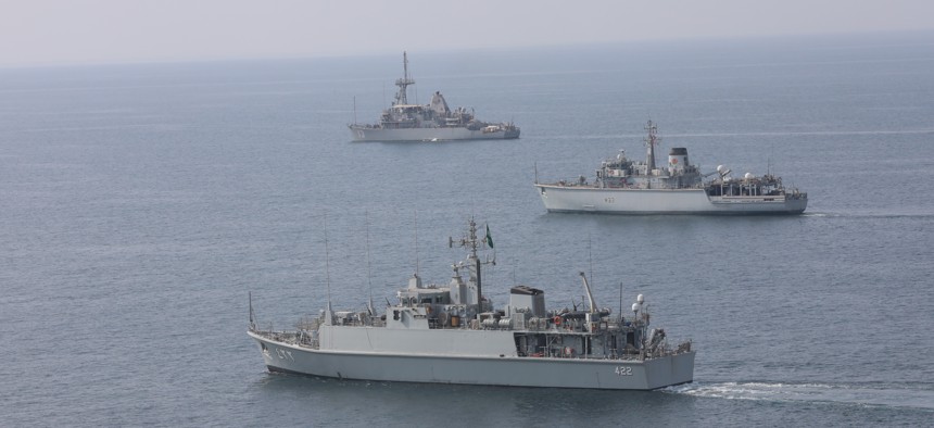 Royal Saudi Naval Force mine countermeasures vessel Al-Shaqra, front, Royal Navy mine countermeasures vessel HMS Brocklesby, and mine countermeasure ship USS Dextrous sail during a 2020 training exercise in the Persian Gulf.