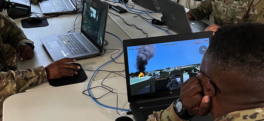 Soldiers from the 309th Regiment run through a scenario using Virtual Battle Space 3 simulation software at the Fort Dix, N.J., in 2022.