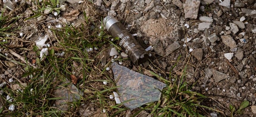 An unexploded cluster bomblet is seen on the ground amid Russia-Ukraine war at the frontline city of Avdiivka, Ukraine, on March 23, 2023.