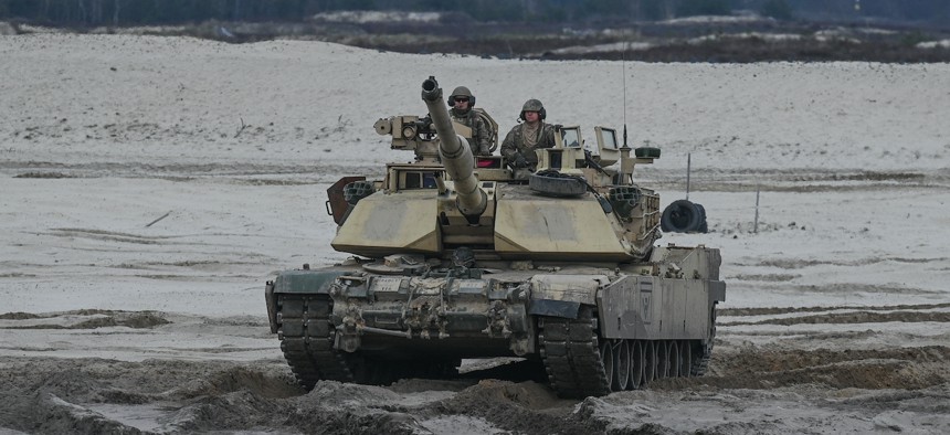 U.S. soldiers from 2nd Battalion, 70th Armor Regiment, 1st Infantry Division, train with M1A2 Abrams tanks in Nowa Deba, Poland, on April 12, 2023.