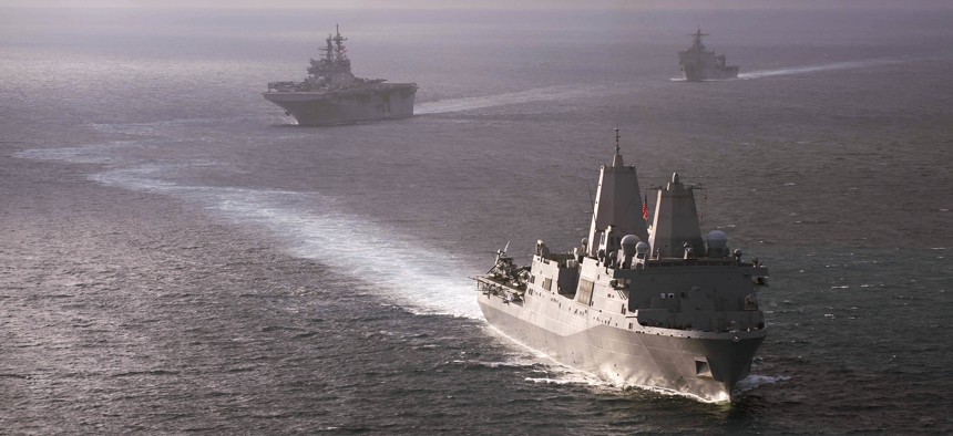 The amphibious transport dock ship USS San Diego (LPD 22) leads other U.S. Navy amphibious warships during a simulated straits transit off the coast of southern California in 2017.