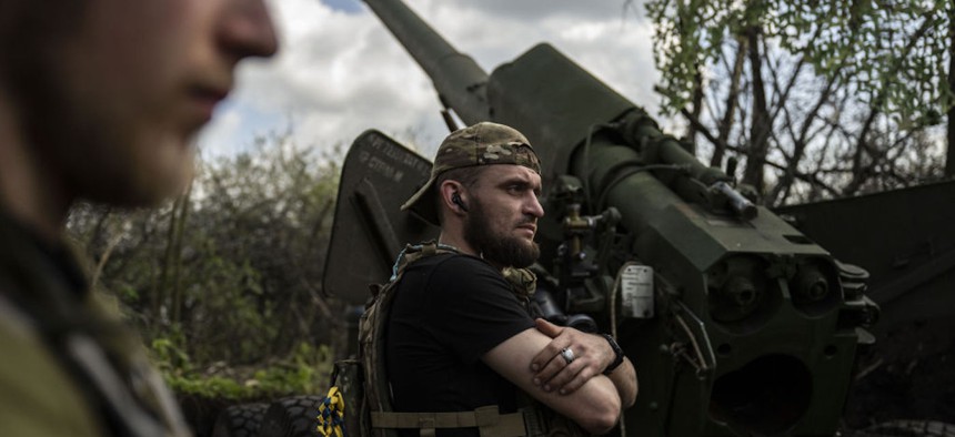 Ukrainian soldiers man artillery guns in Donetsk Oblast, Ukraine, on April 24, 2023.