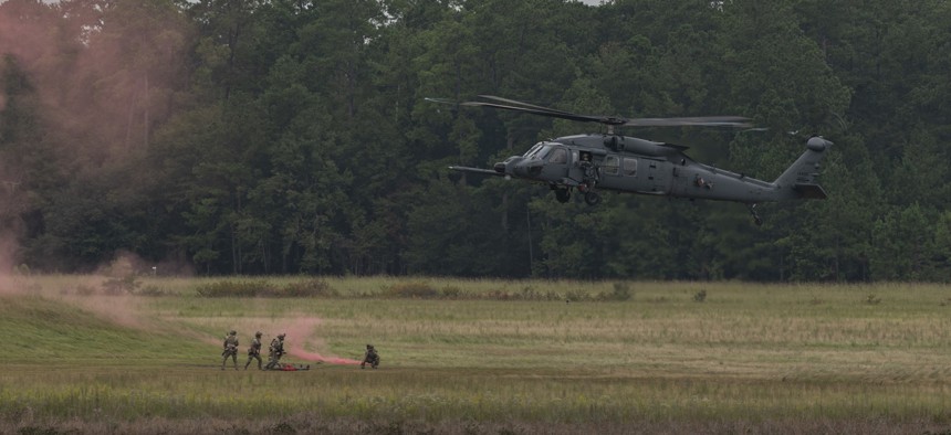 Airmen of the U.S. Air Force's 38th Rescue Squadron use a HH-60W Jolly Green II helicopter to demonstrate combat search and rescue at Moody Air Force Base, Georgia, Sept. 9, 2022.