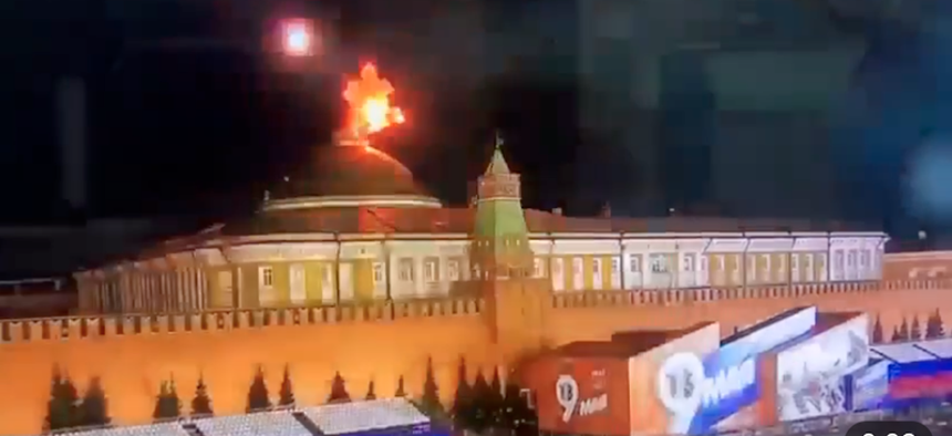 A screenshot of a video posted to the Telegram messaging service purports to show a drone exploding over the Kremlin in the early hours of May 3, 2023.