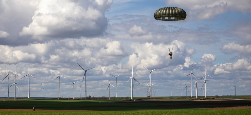 A paratrooper assigned to U.S. Special Operations Command Europe descends to a drop zone near Alzey, Germany during a static-line training jump, April 14, 2023. 