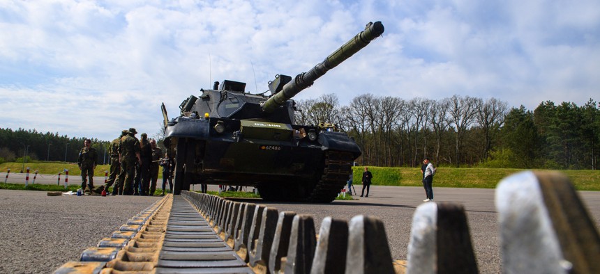 Ukrainian soldiers work on a Leopard 1 A5 main battle tank at the Bundeswehr site in Klietz in northern Saxony-Anhalt on May 5, 2023. Their instructors are German and Danish soldiers and industry technicians. 