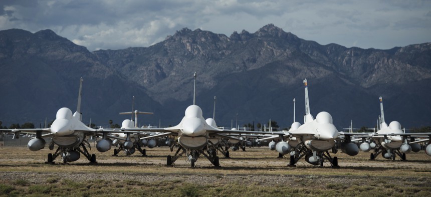 In this 2015 photo, General Dynamics F-16 fighter jets are seen in the boneyard at the Aerospace Maintenance and Regeneration Group on Davis-Monthan Air Force Base in Tucson, Arizona. 