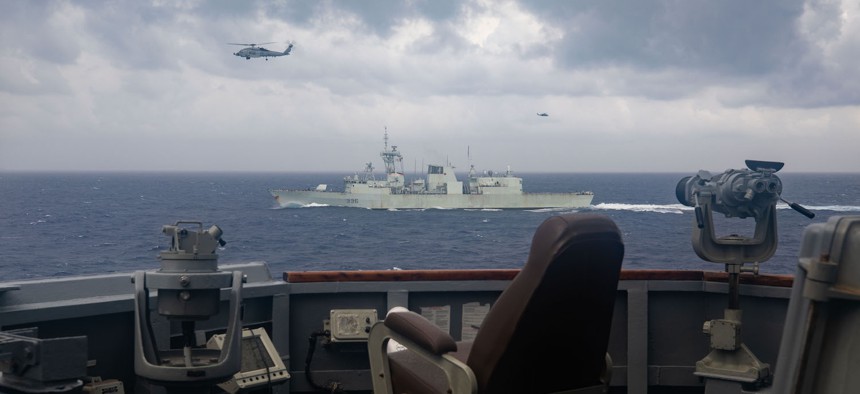 Arleigh Burke-class guided-missile destroyer USS Chung-Hoon (DDG 93) sails alongside the Halifax-class frigate HMCS Montreal (FFG 336) during Surface Action Group operations as a part of exercise “Noble Wolverine”.