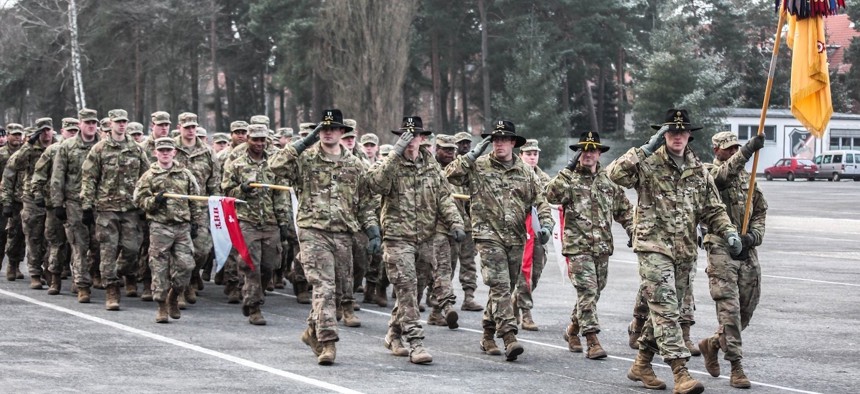 U.S. Soldiers march in formation during a ceremony hosted by the Polish 10th Armored Cavalry Brigade in Swietoszow, Poland, Jan. 22, 2018. 