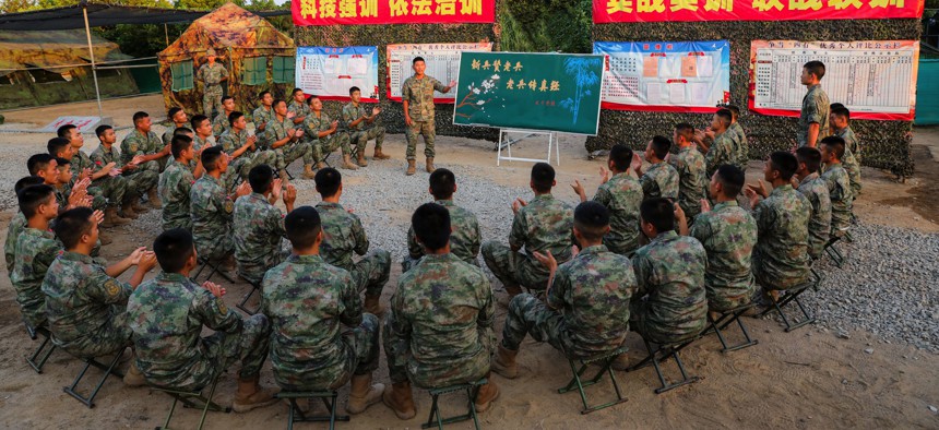 New recruits to China's People's Liberation Army receive a lecture from veterans near Zhangzhou, China, on September 4, 2022.