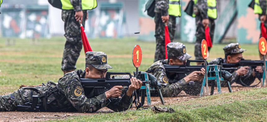 Candidates take a shooting test at a shooting test center in Chongzuo, South China's Guangxi Zhuang Autonomous region, May 20, 2023.