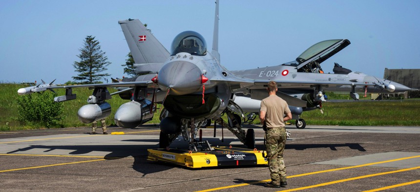 A Danish F-16 fighter jet with rockets is pictured at the Fighter Wing Skrydstrup Air Base near Vojens, Denmark, on May 25, 2023. 