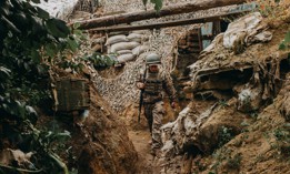 Ukrainian Soldier Mykhailo walks in the trenches in the front-line positions near Toresk, in Donetsk region, Ukraine on June 27, 2023. 
