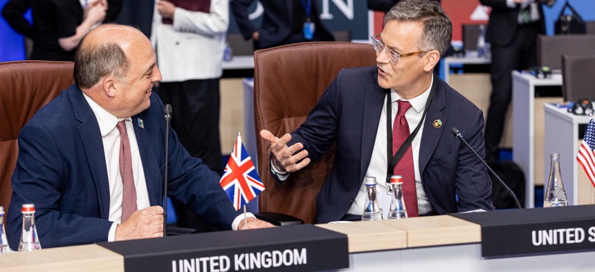 UK Secretary of State for Defence Ben Wallace and U.S. Defense Undersecretary for Policy Colin Kahl talk at the informal meeting of defense ministers at the 2023 NATO Summit on July 11, 2023 in Vilnius, Lithuania.