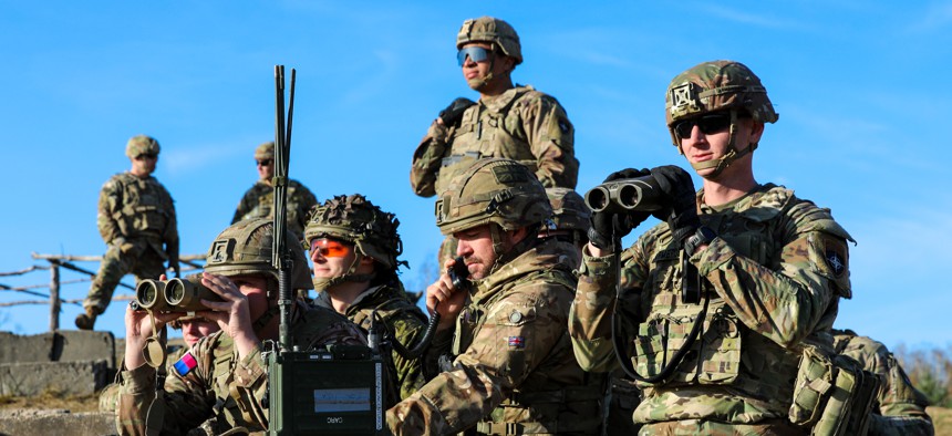 Soliders with NATO's enhanced Forward Presence Battlegroup Poland take part in a live-fire exercise in Toruń, Poland, on Nov. 3, 2022.