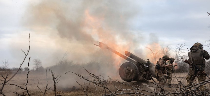 Artillerymen from the 24th assault battalion shooting from 122 mm howitzer D-30 into Russian positions near Bakhmut, Ukraine, in March 2023. 