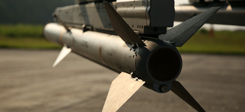In this 2014 photo, an AIM-120A advanced medium-range air-to-air missile secured aboard an AV-8B Harrier. 