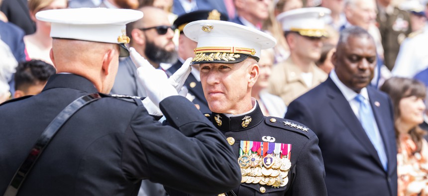 Former Marine Corps Commandant Gen. David Berger, left, and Gen. Eric Smith, acting commandant, conduct a during relinquishment of office ceremony for Berger at Marine Barracks Washington on July 10, 2023.