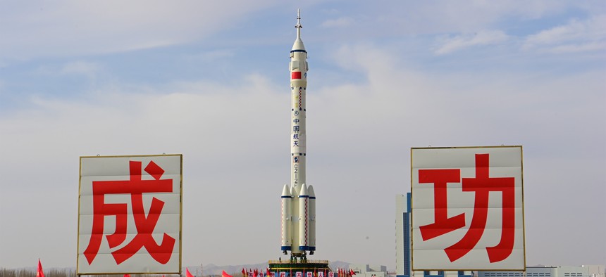 The Shenzhou-15 crewed spaceship and its Long March-2F carrier rocket are prepped for launch at the Jiuquan Satellite Launch Center in northwest China on Nov. 21, 2022.