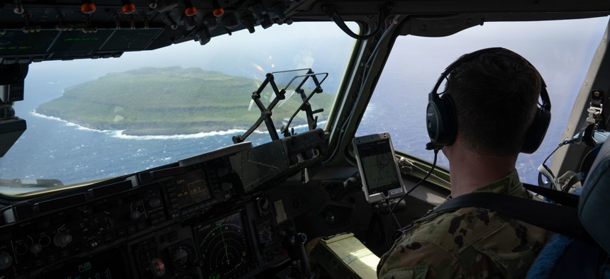 A U.S. Air Force pilot assigned to the 3rd Air Expeditionary Wing flies a C-17 Globemaster III assigned to the 15th Wing, Joint Base Pearl-Hickam, Hawaii, over the Northern Mariana Islands during Exercise Agile Reaper 23-1, March 4, 2023. 
