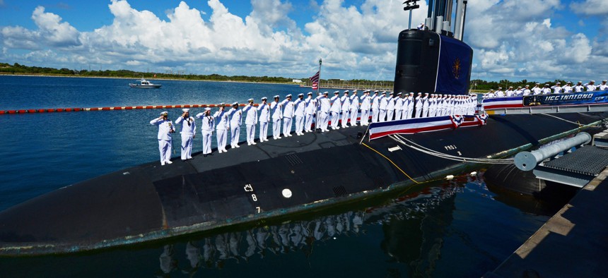 In this 2018 photo, the crew of USS Indiana salutes during the commissioning ceremony of the USS Indiana, the Navy's 16th Virginia-class fast-attack submarine and the third ship named for the State of Indiana, in Port Canaveral, Florida.