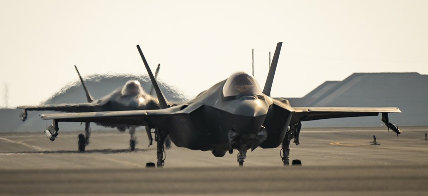 Two U.S. Air Force F-35A Lightning II aircraft from the 421st Expeditionary Fighter Squadron taxi off the runway at Al Udeid Air Base, Qatar, Sept. 5, 2023.