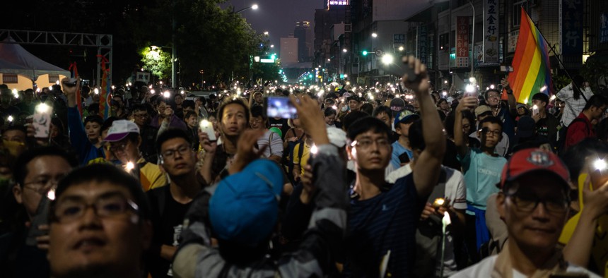 Kaohsiung People wave their smartphones with the LED lights in Kaohsiung, Taiwan on December 21, 2019. 