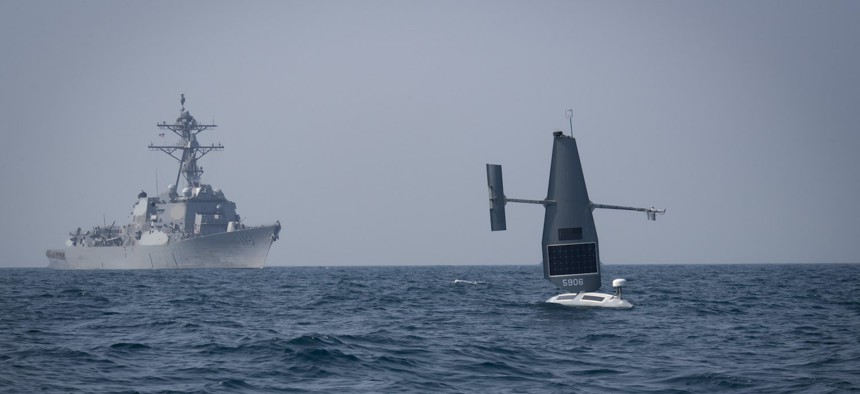 A Saildrone Explorer unmanned surface vessel (USV) operates with guided-missile destroyer USS Delbert D. Black (DDG 119) in the Arabian Gulf during exercise Phantom Scope, Oct. 7, 2022.