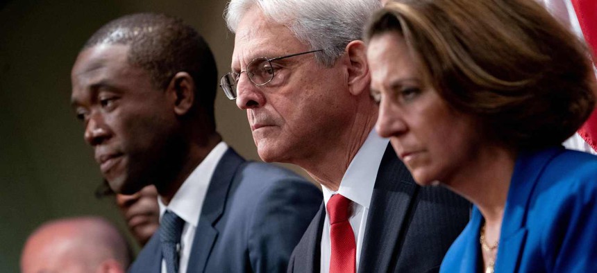 US Deputy Treasury Secretary Wally Adeyemo looks on as Attorney General Merric Garland takes questions during a press conference to announce disruptions of the fentanyl precursor chemical supply chain at the Justice Department in Washington, DC, on October 3, 2023. 