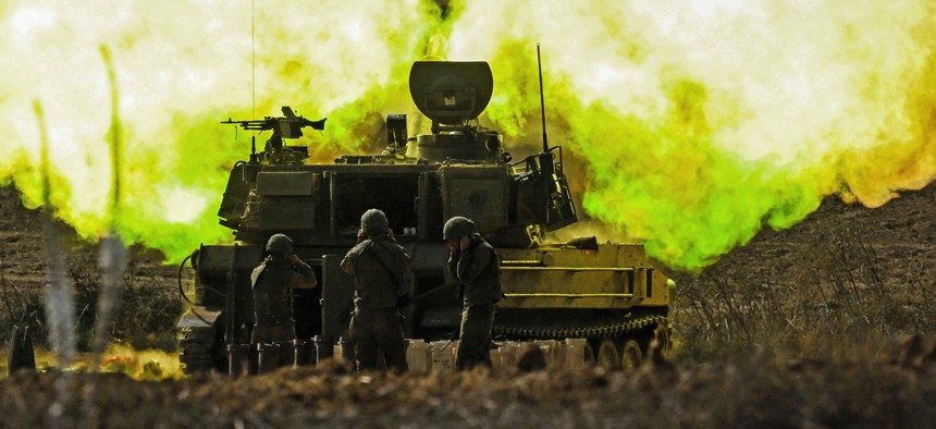 An IDF artillery unit fires towards Gaza on October 11, 2023, near Netivot, Israel.