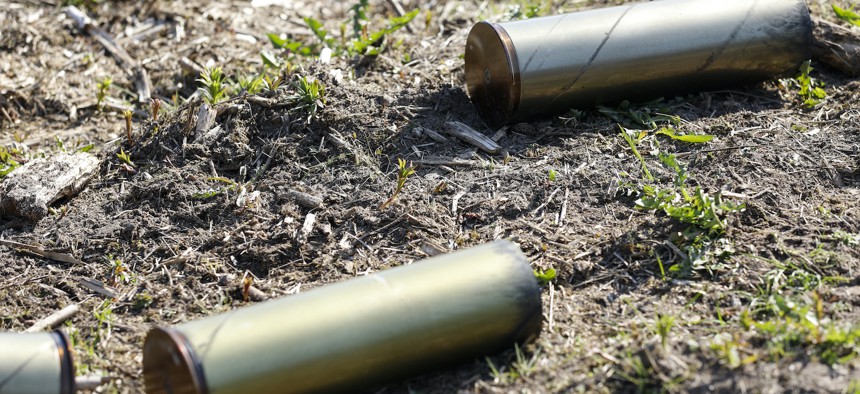 Empty 105 mm shells from the M119 howitzer during a live fire exercise in Estonia, May 10, 2021.