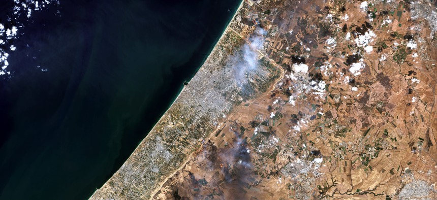 A Oct. 7, 2023, satellite view shows smoke plumes along the Gaza-Israel border.