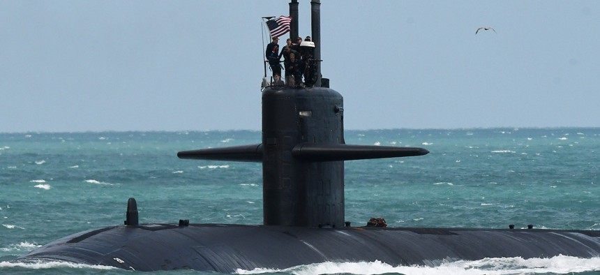 A nuclear-powered U.S. Navy submarine cruises into the Navy Port at Port Canaveral in March 2023. 